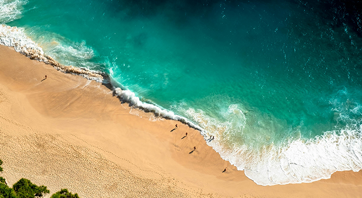 Aerial coastline panorama illustrating best time to travel to Bali weather and surf