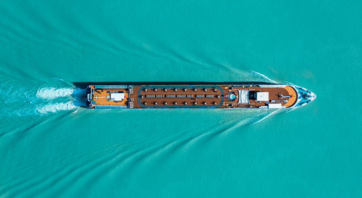 Cruise ship hacks guide: traveler using magnetic hooks in a cruise cabin while checking ship time on phone