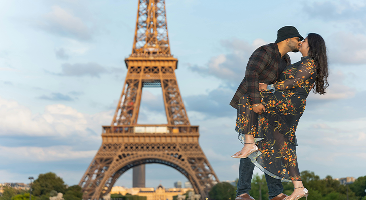 Best places to visit in December for couples—two travelers holding hands at a winter market