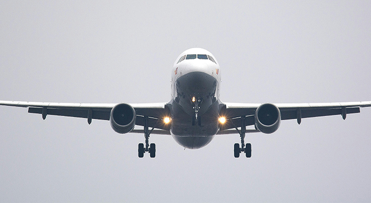 Tips for a first time flyer - a traveler checking a departures board