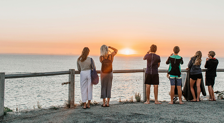 Solo travelers in small group adventure tour exploring mountain landscapes